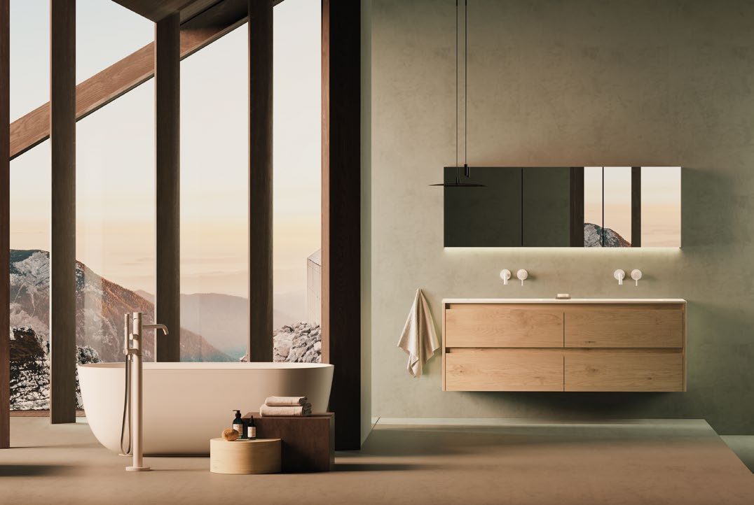 Serie Alpin-Deep 160 in Wildeiche Skandic mit Waschtisch aus Solid Surface, freistehende Badewanne vor Bergpanorama